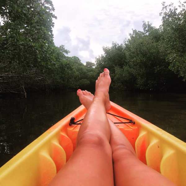 a person riding on the back of a boat