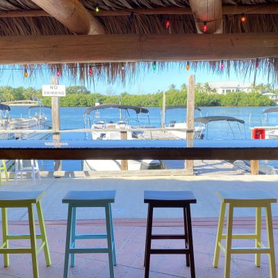 a chair sitting in front of a body of water