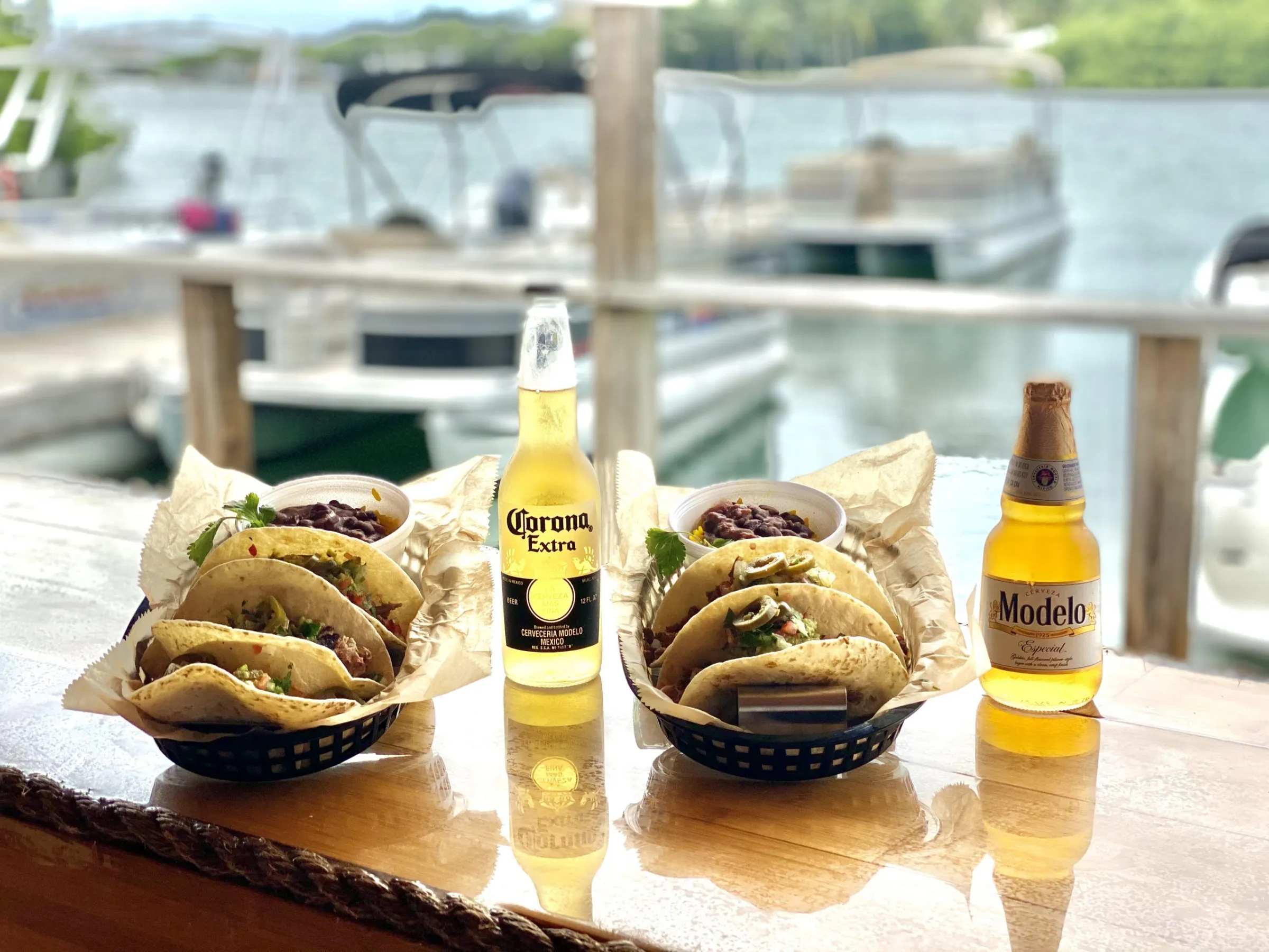 a bottle of wine sitting on top of a picnic table