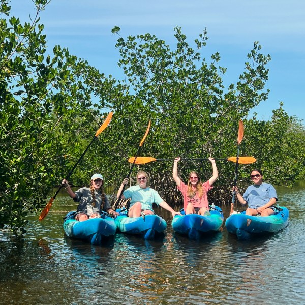 a group of people on a raft in a body of water